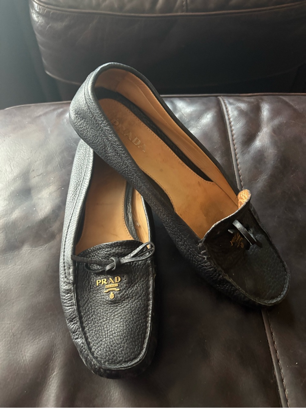Prada Black Pebbled Leather Moccasin Loafers with Gold Logo